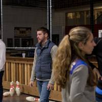 Alumni fowling and socializing at the Fowling Fun Event